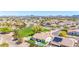 An aerial shot of a neighborhood showcasing a home with a private pool and solar panels at 20540 N 86Th Ln, Peoria, AZ 85382