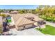 A landscape view featuring a single-Gathering home, pool, manicured lawn, and desert surroundings at 20540 N 86Th Ln, Peoria, AZ 85382