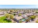 Aerial view of a property with a private pool and solar panels in a well-maintained community at 20540 N 86Th Ln, Peoria, AZ 85382