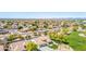Aerial view of a home with a three car garage and well-manicured landscaping in a planned community at 20540 N 86Th Ln, Peoria, AZ 85382