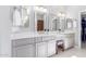 Bright bathroom featuring dual vanities, quartz countertops, and modern fixtures at 20540 N 86Th Ln, Peoria, AZ 85382