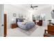 Serene bedroom featuring tile floors, a ceiling fan, plantation shutters, and neutral decor at 20540 N 86Th Ln, Peoria, AZ 85382