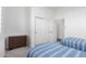 Cozy bedroom featuring two beds, neutral walls, soft carpet, and plenty of storage at 20540 N 86Th Ln, Peoria, AZ 85382