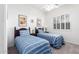 Charming bedroom with two beds, neutral walls, soft carpet, shutters, and stylish décor at 20540 N 86Th Ln, Peoria, AZ 85382
