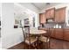 Cozy breakfast nook with hardwood floors and direct access to the kitchen at 20540 N 86Th Ln, Peoria, AZ 85382