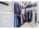 Organized walk-in closet with ample shelving and hanging space for clothes and accessories at 20540 N 86Th Ln, Peoria, AZ 85382