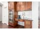 Convenient coffee bar area with custom cabinetry and stainless steel oven appliances at 20540 N 86Th Ln, Peoria, AZ 85382