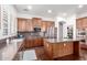 Well-equipped kitchen with stainless steel appliances, an island, and sleek countertops at 20540 N 86Th Ln, Peoria, AZ 85382