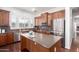 Spacious kitchen featuring stainless steel appliances, an island, and ample cabinet space at 20540 N 86Th Ln, Peoria, AZ 85382