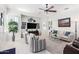Bright living room with tile floors, ceiling fan, and comfortable seating arrangement at 20540 N 86Th Ln, Peoria, AZ 85382