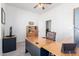 Functional home office with a large desk, comfortable chair, and ample natural light at 20540 N 86Th Ln, Peoria, AZ 85382