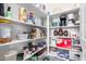 Well-organized pantry with abundant shelving for maximum storage and convenience at 20540 N 86Th Ln, Peoria, AZ 85382