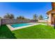 Inviting backyard features a sparkling pool with fountain features and comfortable lounge chairs at 20540 N 86Th Ln, Peoria, AZ 85382