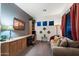 Cozy living room offering a comfortable sofa, custom built-ins, and modern decor at 20933 N 70Th Dr, Glendale, AZ 85308