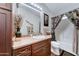 Well-maintained bathroom featuring a vanity, sink, toilet, and shower with curtain at 2101 S Meridian Rd # 99, Apache Junction, AZ 85120