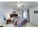 Comfortable bedroom featuring a queen bed, neutral decor, and a ceiling fan for a relaxing atmosphere at 2101 S Meridian Rd # 99, Apache Junction, AZ 85120