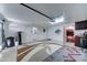 Spacious garage featuring a pegboard, work area, and overhead lighting at 2101 S Meridian Rd # 99, Apache Junction, AZ 85120