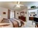 Serene main bedroom with a comfortable bed, dresser, and ensuite bathroom access for added convenience at 2101 S Meridian Rd # 99, Apache Junction, AZ 85120