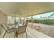 Covered patio featuring an outdoor dining set, with a view of the landscaped backyard at 2101 S Meridian Rd # 99, Apache Junction, AZ 85120