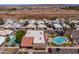 Aerial view of a mobile home park featuring a community pool and construction site in the background at 2121 N Center St # 141, Mesa, AZ 85201