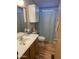 Clean bathroom featuring a vanity, toilet, and shower with curtain at 2121 N Center St # 141, Mesa, AZ 85201