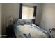 Calming bedroom with butterfly patterned bedding and bedside lamps at 2121 N Center St # 141, Mesa, AZ 85201
