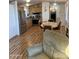 Inviting living room features a kitchen, dining area, and a comfortable recliner sofa at 2121 N Center St # 141, Mesa, AZ 85201