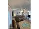 Cozy living room features a round dining table, recliner, and a decorative chandelier at 2121 N Center St # 141, Mesa, AZ 85201