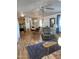 Inviting living room with wood floors, dining area, and lots of natural light at 2121 N Center St # 141, Mesa, AZ 85201