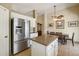 Kitchen featuring stainless steel appliances, granite countertops, and an adjacent dining area at 2123 E Catclaw St, Gilbert, AZ 85296