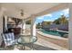 View of covered patio, pool, seating, and rock features in the yard at 2123 E Catclaw St, Gilbert, AZ 85296