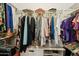Walk-in closet features extensive shelving, storage, and organization space at 2123 E Catclaw St, Gilbert, AZ 85296