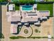Expansive aerial view of home showcasing the backyard pool, turf and front circular driveway at 2285 E Chandler Heights Rd, Chandler, AZ 85249