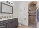 Elegant bathroom showcasing dark wood cabinets and a tiled walk-in shower at 2285 E Chandler Heights Rd, Chandler, AZ 85249