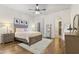 Charming bedroom featuring a queen size bed, hardwood flooring and ensuite bath at 2285 E Chandler Heights Rd, Chandler, AZ 85249
