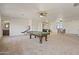 Expansive game room with pool table, lounge and bar area, great for entertaining at 2285 E Chandler Heights Rd, Chandler, AZ 85249
