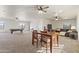 Multi-purpose room with pool table, dining table, lounge area, and ample natural light at 2285 E Chandler Heights Rd, Chandler, AZ 85249
