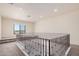 Bright hallway features wrought iron railing and neutral carpet at 2285 E Chandler Heights Rd, Chandler, AZ 85249