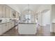 Spacious kitchen with a large island, granite countertops, and modern appliances, bright lighting and cabinets at 2285 E Chandler Heights Rd, Chandler, AZ 85249