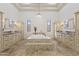 Luxurious main bathroom featuring a jetted tub, dual vanities, and travertine floors at 2285 E Chandler Heights Rd, Chandler, AZ 85249