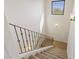 Carpeted staircase with metal railing ascending to an upper level with wall sconces at 2285 E Chandler Heights Rd, Chandler, AZ 85249