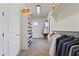 Spacious walk-in closet with shoe racks and clothes hanging system at 2285 E Chandler Heights Rd, Chandler, AZ 85249