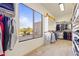 Walk-in closet featuring custom shelving and shoe racks with bright window at 2285 E Chandler Heights Rd, Chandler, AZ 85249