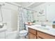 Bathroom with tub, shower, vanity with sink, and decorative shower curtain at 2455 E Broadway Rd # 13, Mesa, AZ 85204
