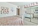 Childs bedroom with playful decor, closet with mirrored doors and bed with pink floral bedding at 2455 E Broadway Rd # 13, Mesa, AZ 85204