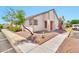 A home exterior with curb appeal, enhanced by mature trees and colorful flowers at 2455 E Broadway Rd # 13, Mesa, AZ 85204