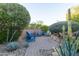 The secluded seating area in the backyard is the perfect place to relax at 27654 N 125Th Dr, Peoria, AZ 85383