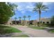 Attractive community building with desert landscaping, palm trees, and stone accents at 27654 N 125Th Dr, Peoria, AZ 85383