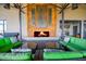 Comfortable outdoor living space with a modern fireplace and stylish seating at 27654 N 125Th Dr, Peoria, AZ 85383