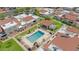 Aerial view of a community pool surrounded by lush greenery, trees, and well-maintained landscaping at 2844 W Christy Dr, Phoenix, AZ 85029